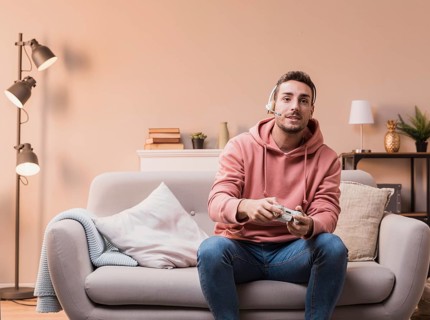 Man with headphones playing