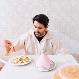 Muslim man eating