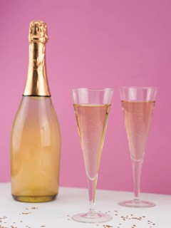 Champagne bottle with filled glasses