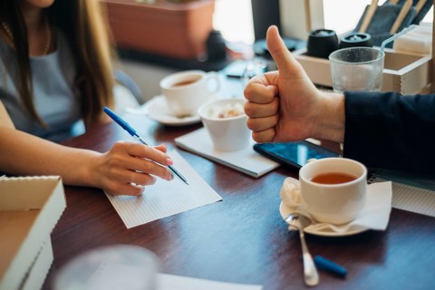 People brainstorming drinking tea cafe
