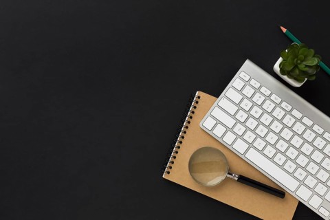 Flat lay work desktop with notebook keyboard