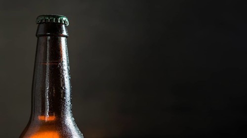 Front view beer glass bottle with copy space