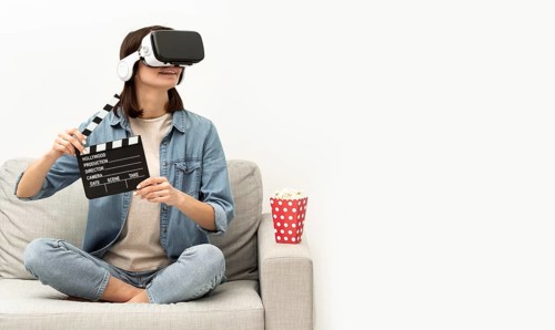 Portrait woman with virtual reality headset eating popcorn