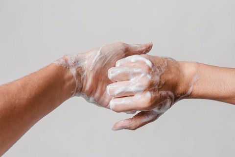 Hygiene concept washing hands with soap front view