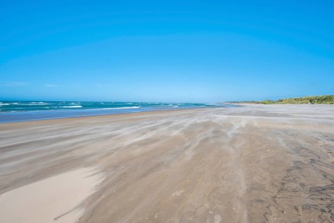 Wide sandy beach by the sea