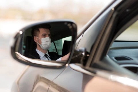 Man car mirror with mask