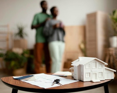 New home keys plan table with defocused couple