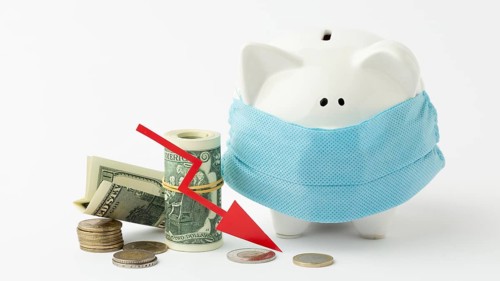 Piggy bank wearing medical mask bankruptcy concept