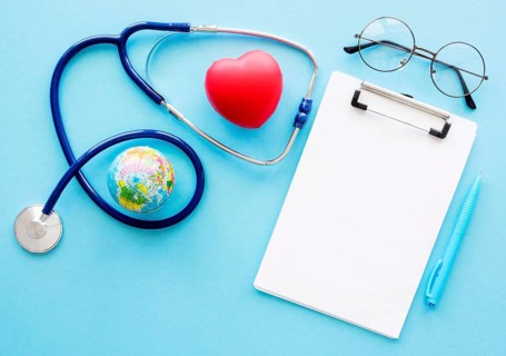 Flat lay notepad with heart shape stethoscope