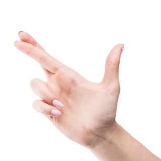 Close up hand with crossed fingers