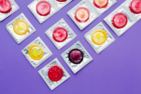 Flat lay arrangement contraception concept purple background