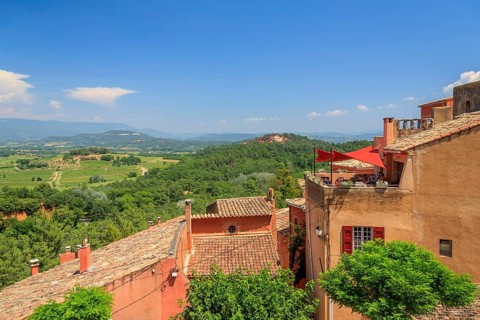 View over the houses of Roussillon into the landscape of the Luberon