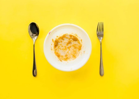 Top view dirty plate with cutlery table