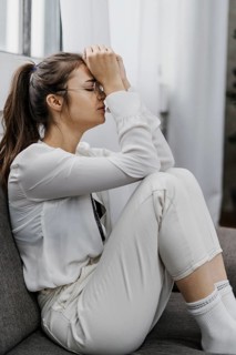 Side view woman looking sad as she works from home