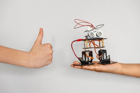 Hand with robot ok sign