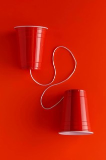 Top view two paper cups with string