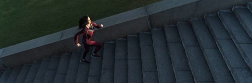 Fit young woman climbing stairs