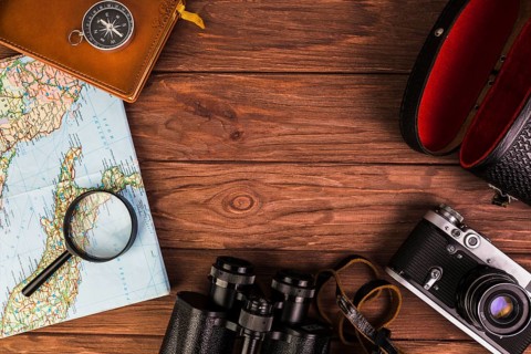 Old fashionable travel stuff wooden table