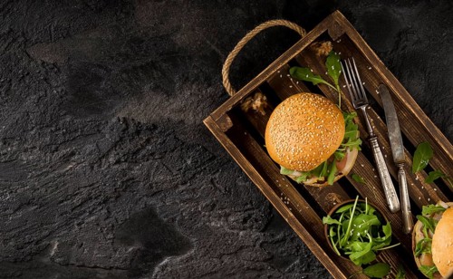Top view burgers basket with copy space