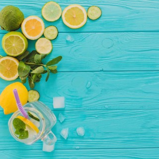 Blue wooden surface with lemons limes