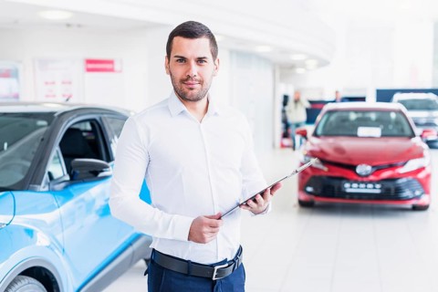 Portrait salesman car dealership