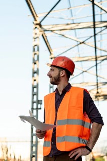 Medium shot man holding plan