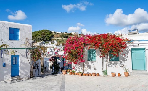White Cycladic house with turquoise windows and doors