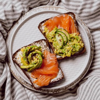 Top view breakfast sandwiches bed with salmon avocado