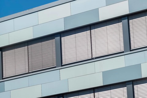 Modern office building with windows and awnings