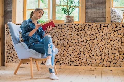 Classy young woman looking book
