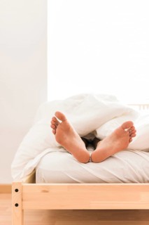 Person s feet blanket