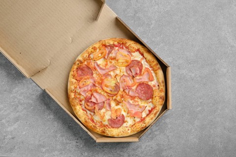 Top view of pizza with ham