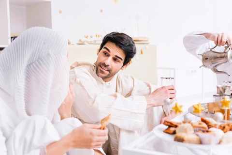 Eid concept with group friends eating