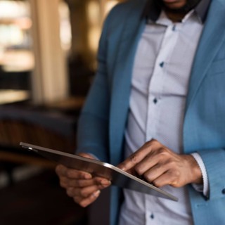 Modern man looking his tablet