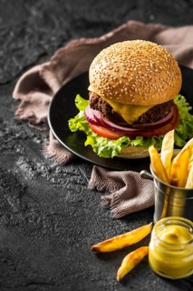 High angle fresh burger fries sauce