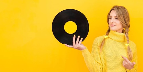Medium shot woman holding vinyl