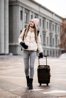 Portrait female student with luggage