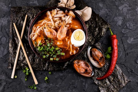 Top view ramen dish with shrimps oysters