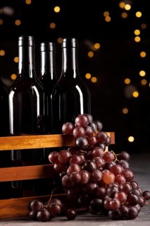 Set wine bottles grapes with bokeh background