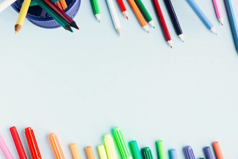 Bright markers pencils white background