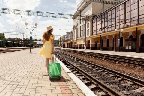 Full shot woman train station