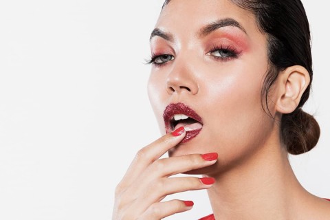 Close up shot model touching dark lips