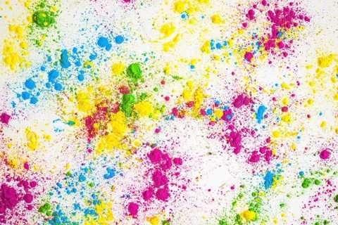 Multicolored powder splatter white background
