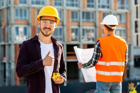 Medium shot portrait smiling architect looking camera