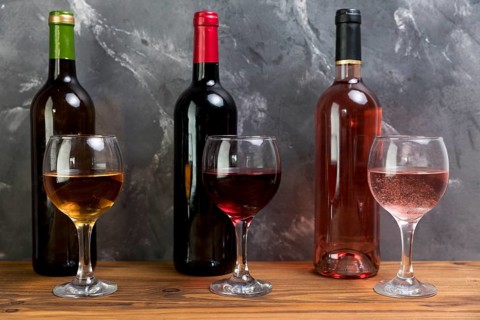 Line wine bottles wineglasses