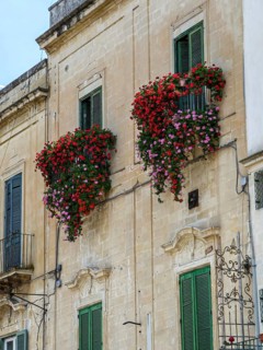 Italian house with balcony and flower boxes