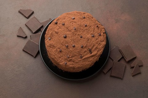 Top view chocolate cake with cocoa powder