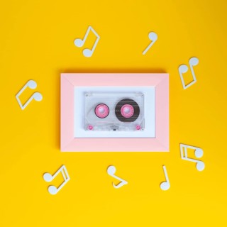 Bright colorful cassette tape with musical notes around it