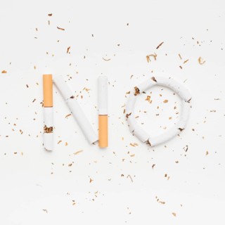 Word no made from broken cigarette with tobacco isolated white background