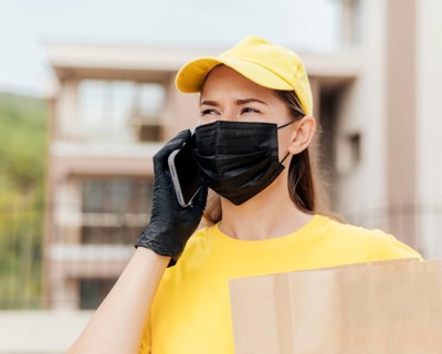 Delivery woman talking phone